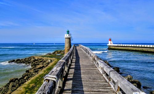 Pier over sea against sky