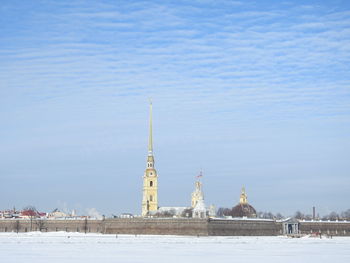 View of buildings against sky during winter