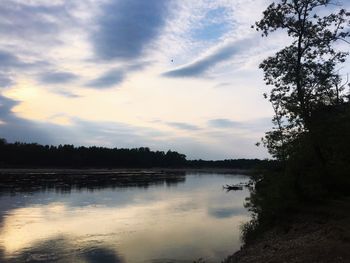 Scenic view of lake against sky during sunset