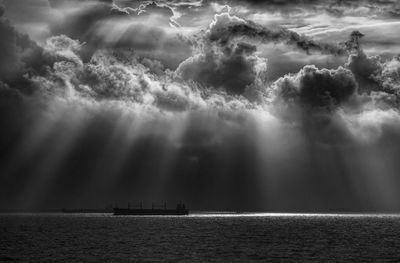 Scenic view of sea against cloudy sky