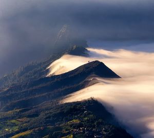 Scenic view of volcanic mountain against sky