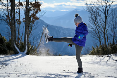 Full length of man on snow covered land