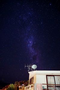 Low angle view of building against sky at night