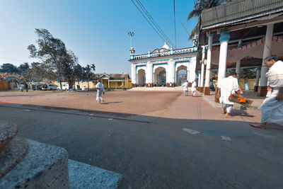 People walking on street in city