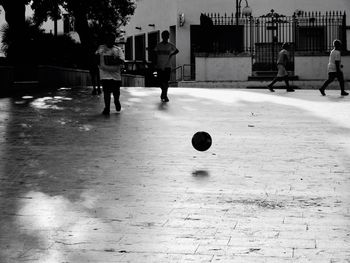 People playing soccer ball on field