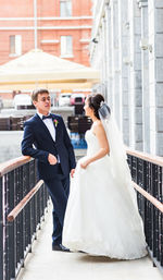 Man and woman holding umbrella