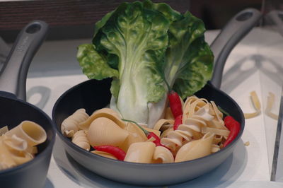 High angle view of chopped fruits in plate on table