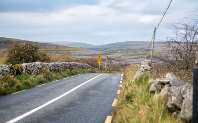 Road and mountain against sky