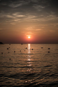 Scenic view of sea against sky at sunset