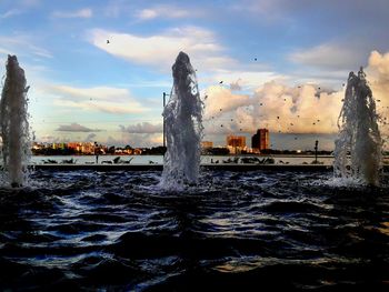 Silhouette of fountain at sunset