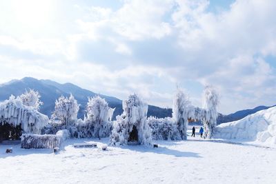 Panoramic view of snowcapped landscape against sky