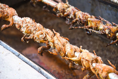 High angle view of meat on barbecue grill