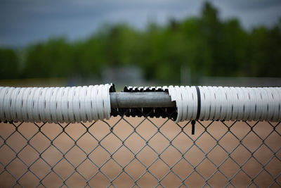 Close-up of metal pipes on land