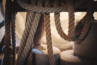 Close-up of rope tied to wooden post