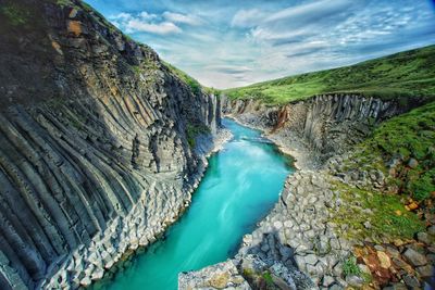 Panoramic shot of water flowing through rocks