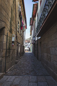 Narrow alley along buildings