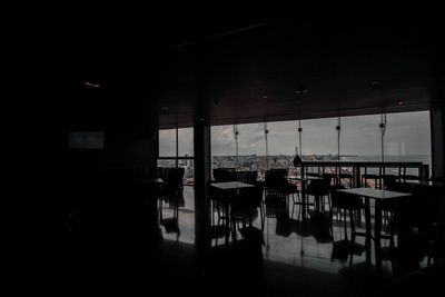 Empty chairs and tables in restaurant