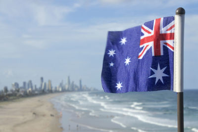 Close-up of flag against blue sky