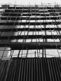 Low angle view of glass building against sky