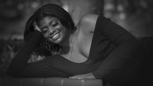 Smiling woman relaxing outdoors