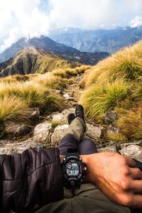 Man standing by mountains against sky