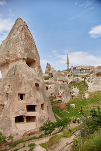 Ruins of building against cloudy sky