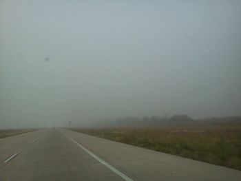 Empty road in foggy weather