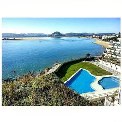 Scenic view of sea against blue sky