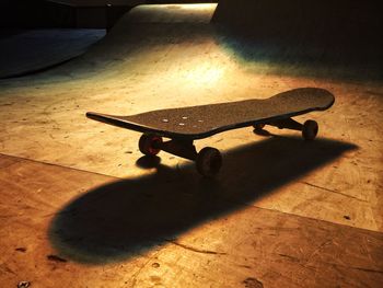 High angle view of skateboard on floor at park