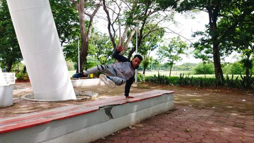 Side view of young man in park