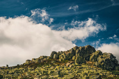 Low angle view of rocks against sky