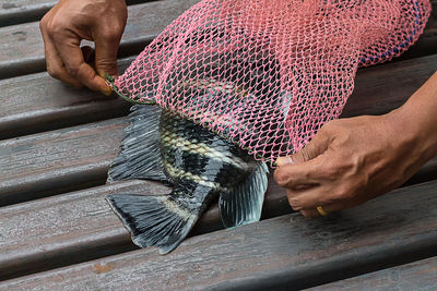 Close-up of man working on wood