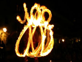 Close-up of illuminated lamp at night