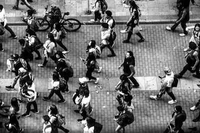 High angle view of people walking on road