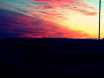 Scenic view of silhouette landscape against sky during sunset