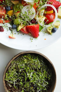 High angle view of chopped fruits in bowl on table