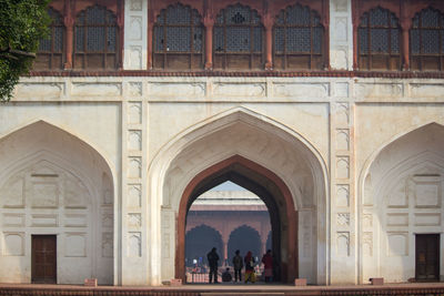 Group of people in front of historical building