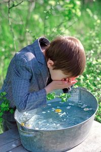 Rear view of boy in water