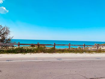 Scenic view of sea against clear blue sky