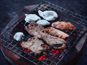 High angle view of meat on barbecue grill