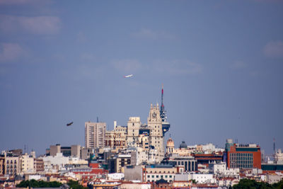 Buildings in city against sky