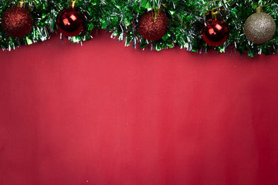 Close-up of christmas tree against wall