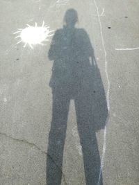 Shadow of people on street