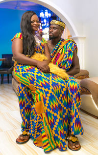 Young woman sitting on the wall