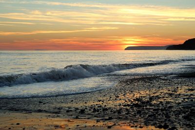 Scenic view of sea at sunset