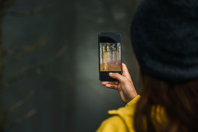 Man photographing through smart phone