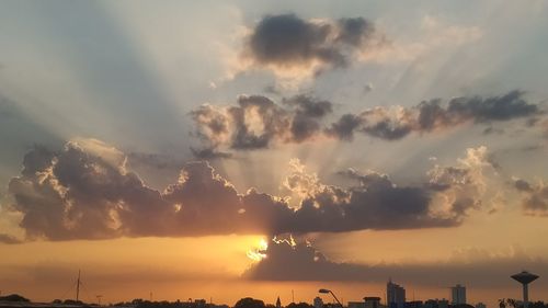 Low angle view of silhouette buildings against sky during sunset