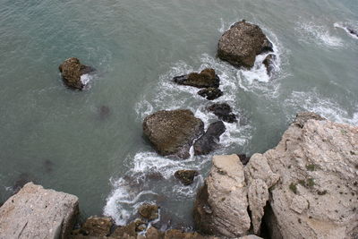 High angle view of rock formation in sea