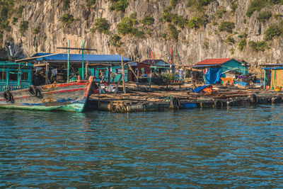 Fishing boats moored in sea