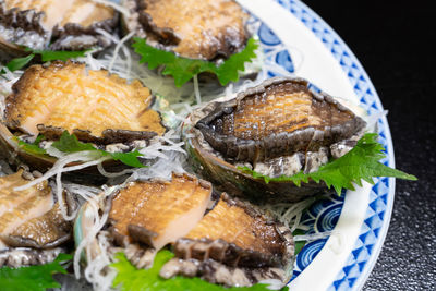 Close-up of seashells in plate